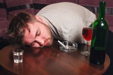 drunk-man-sleep-on-wooden-table_266732-25521.jpg